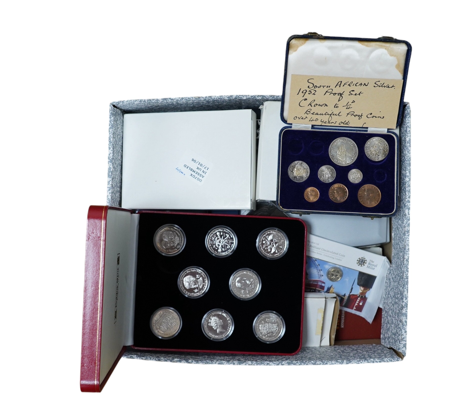 A large collection of Royal Mint boxed coins. Condition - fair